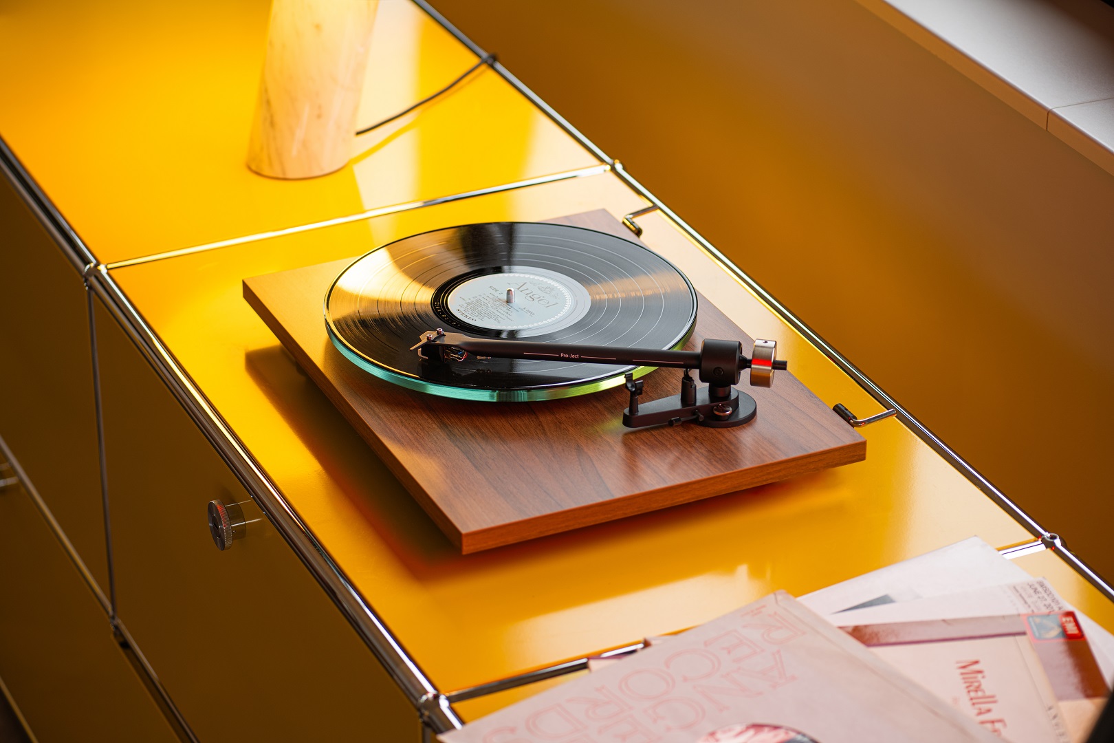 T2 Super Phono 4 standing on a yellow shelf playing a record